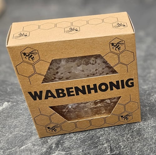 Wabenhonig in einer Kartonverpackung mit Sichtfenster
